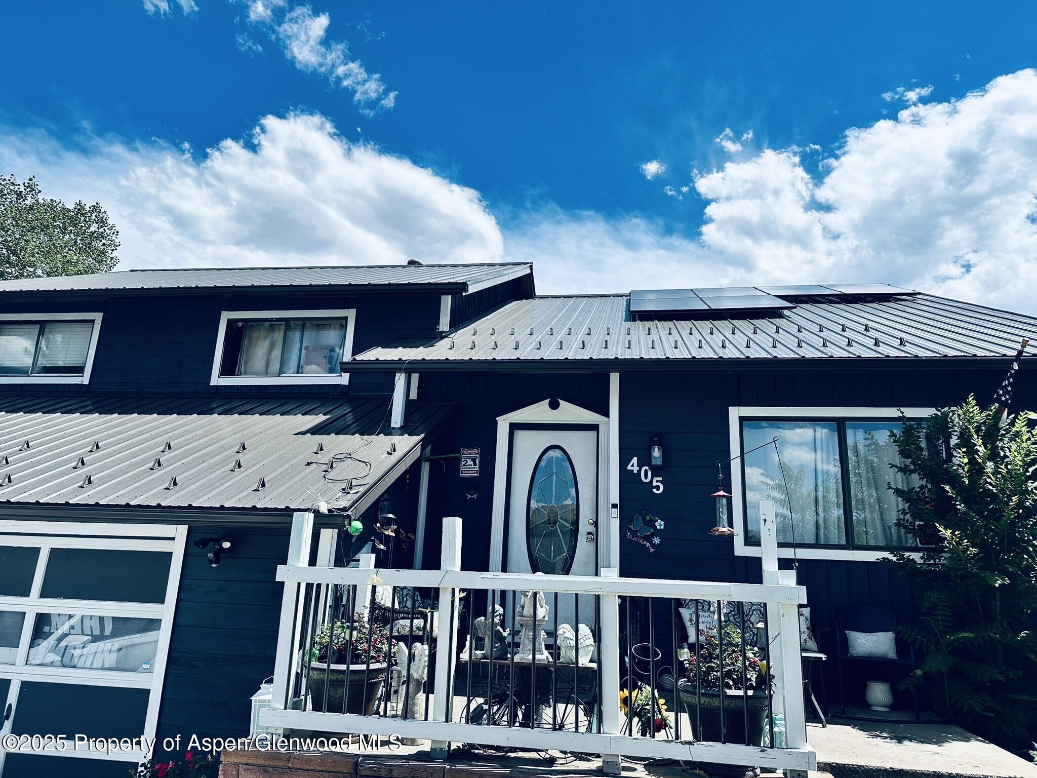 a view of a brick house with large windows