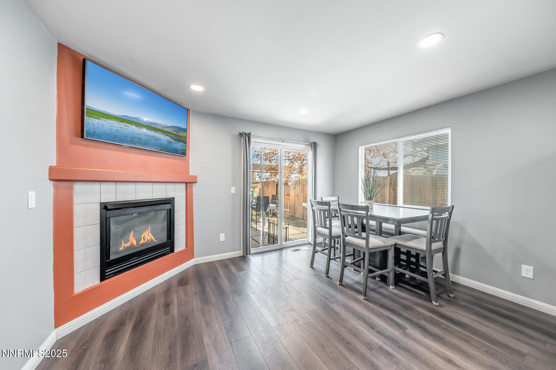 7447 Findhorn Drive Reno, NV 89506 - Photo 11 of 27 a living room with furniture and a fireplace