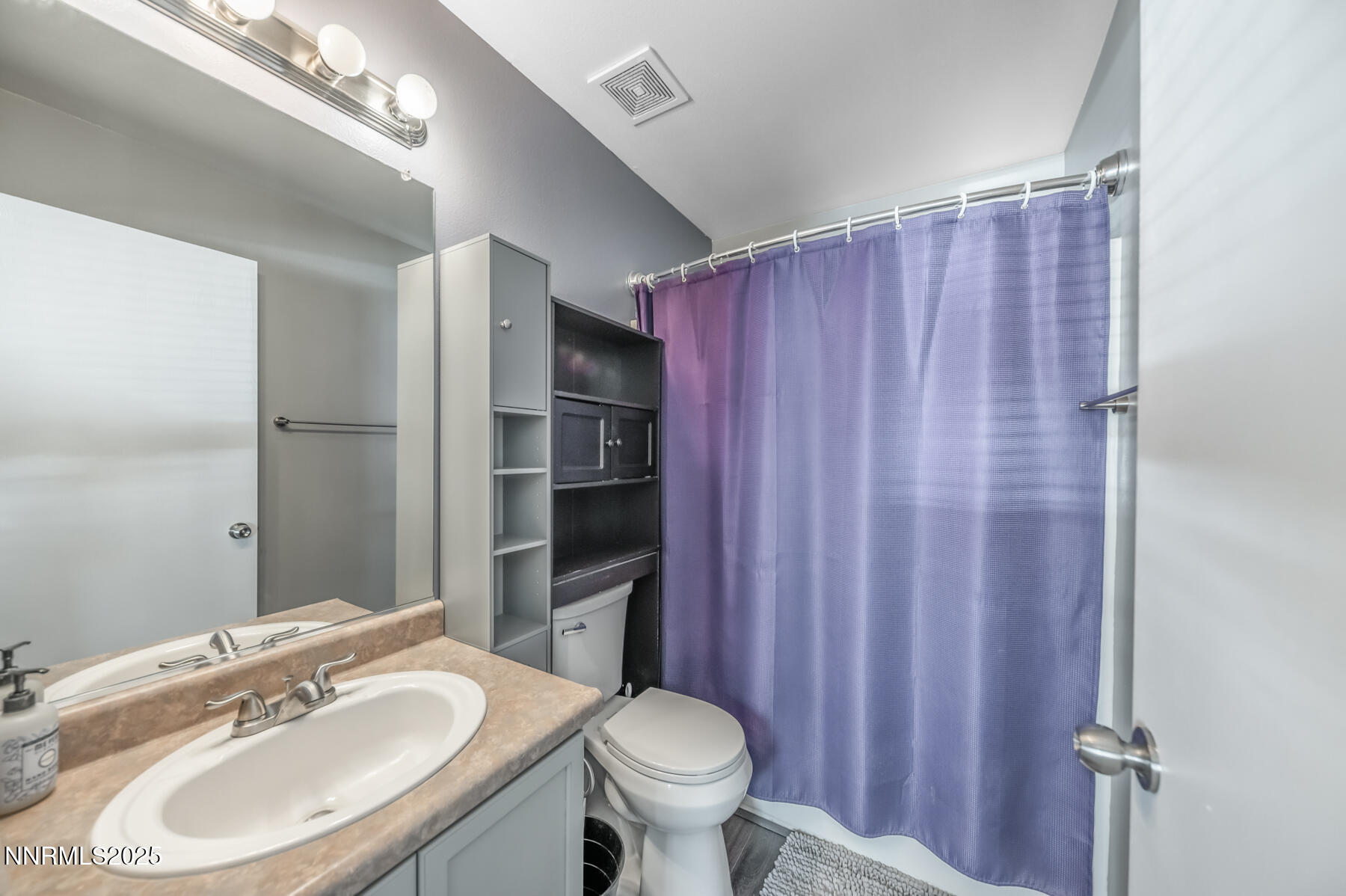 7447 Findhorn Drive Reno, NV 89506 - Photo 14 of 27 a bathroom with a sink toilet and shower