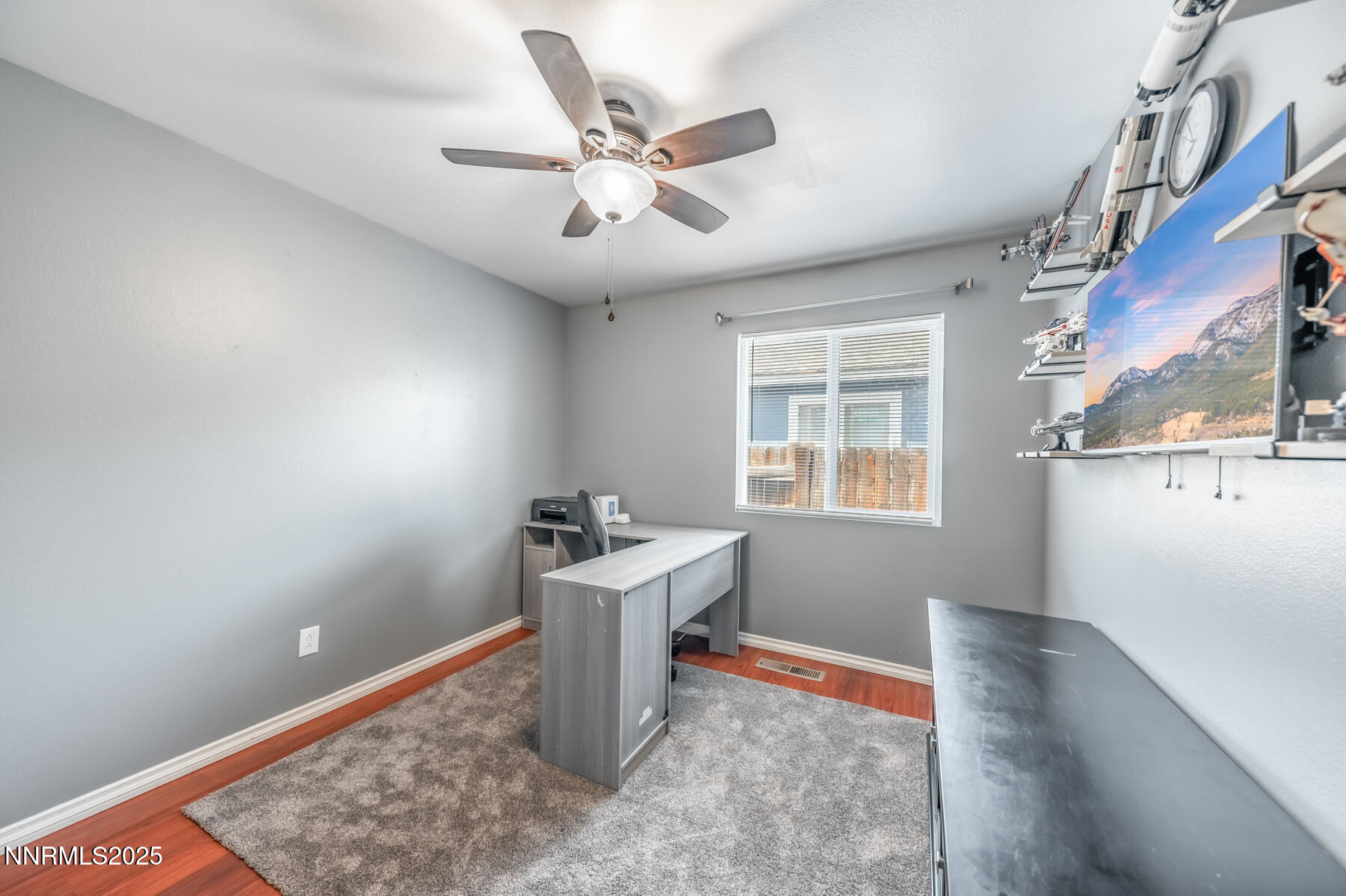 7447 Findhorn Drive Reno, NV 89506 - Photo 16 of 27 a room with chandelier fan and windows
