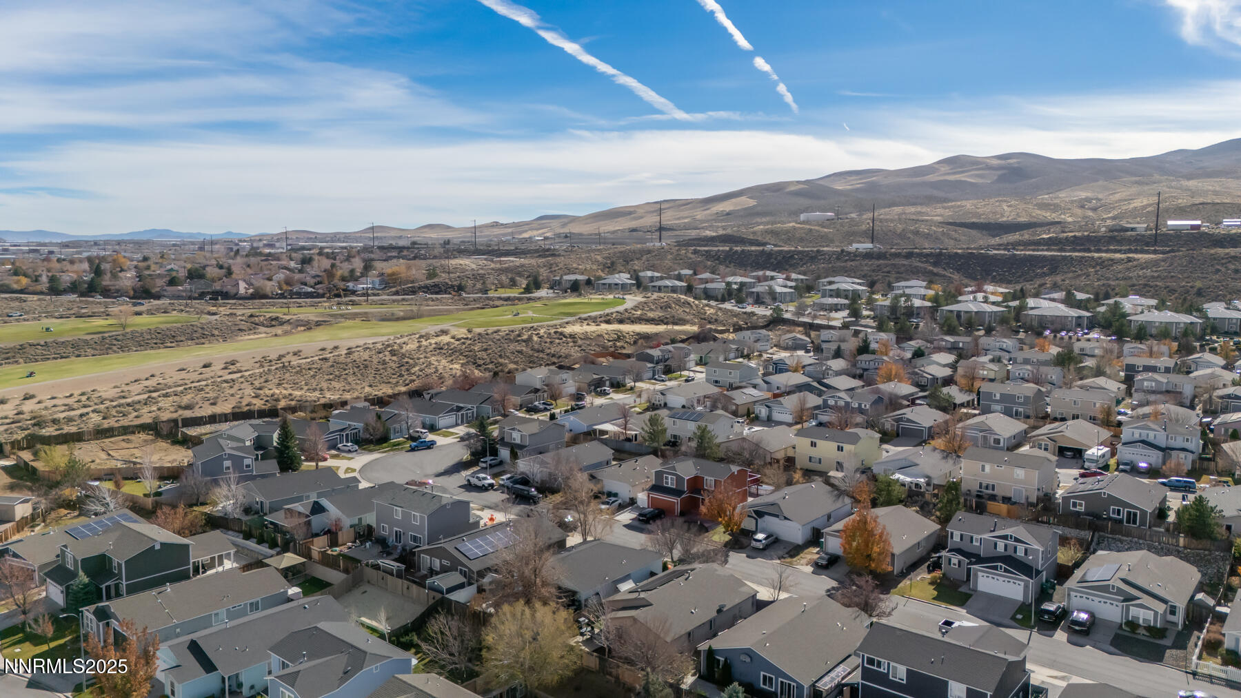 7447 Findhorn Drive Reno, NV 89506 - Photo 24 of 27 an aerial view of a town with mountains in the background