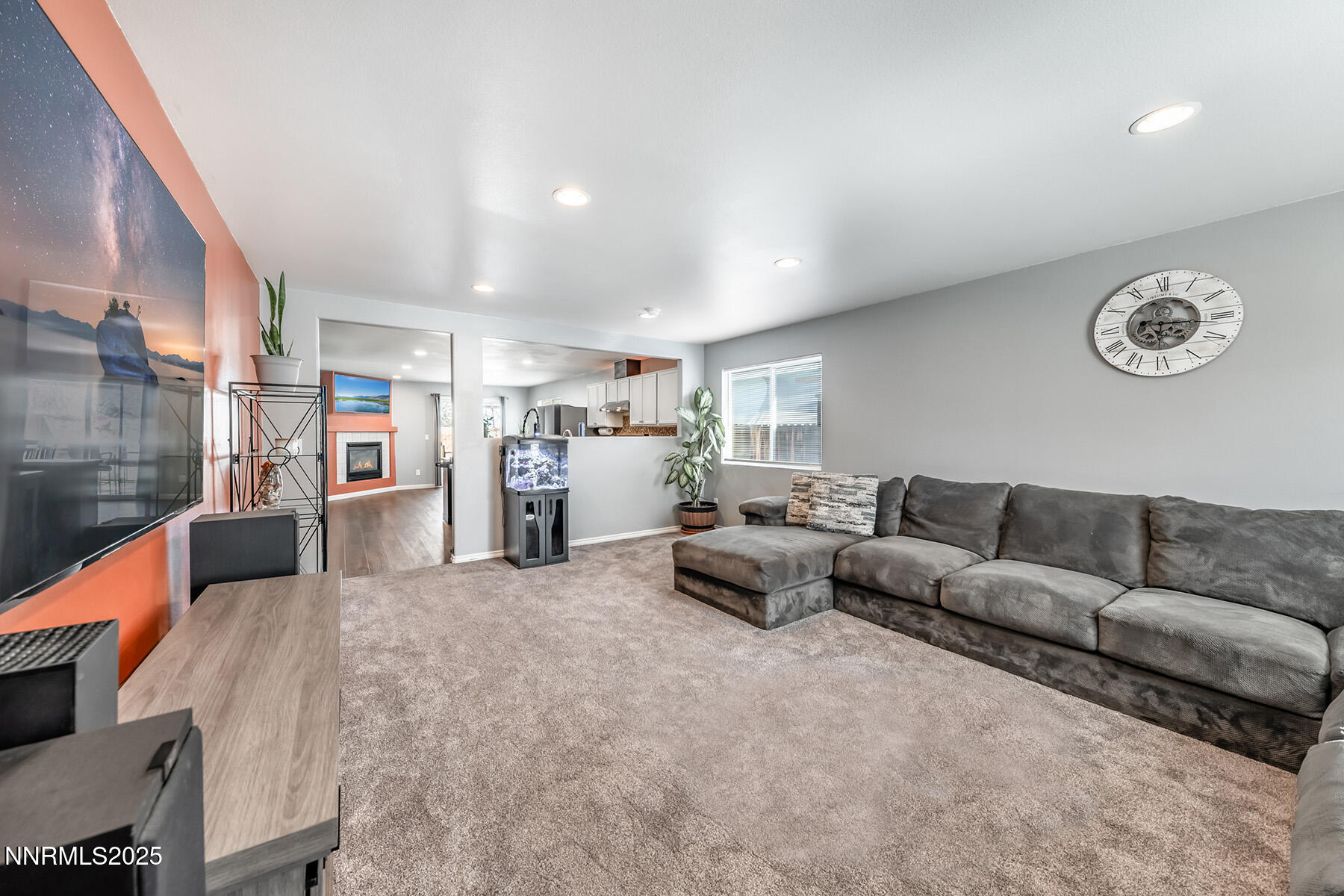 7447 Findhorn Drive Reno, NV 89506 - Photo 4 of 27 a living room with furniture and a table