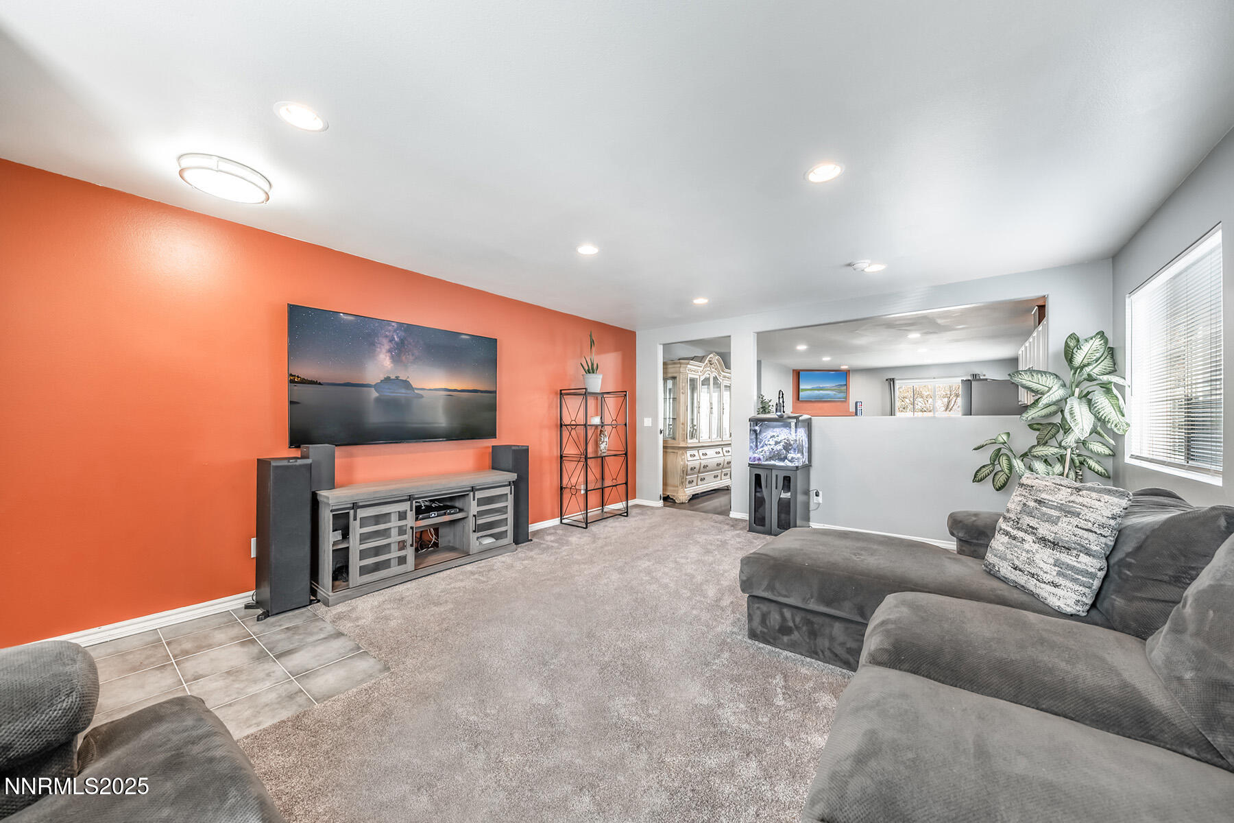 7447 Findhorn Drive Reno, NV 89506 - Photo 5 of 27 a living room with furniture and a flat screen tv
