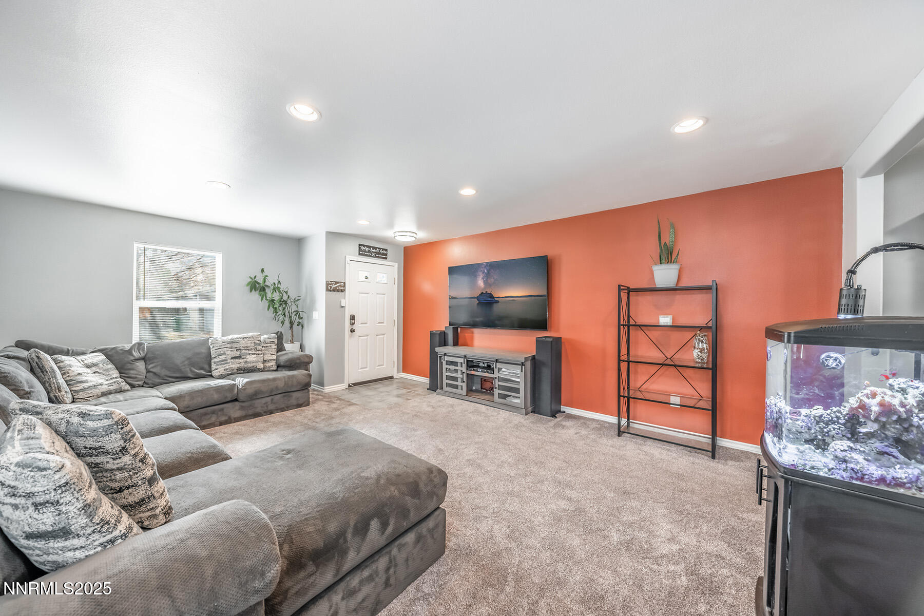 7447 Findhorn Drive Reno, NV 89506 - Photo 6 of 27 a living room with furniture and a flat screen tv