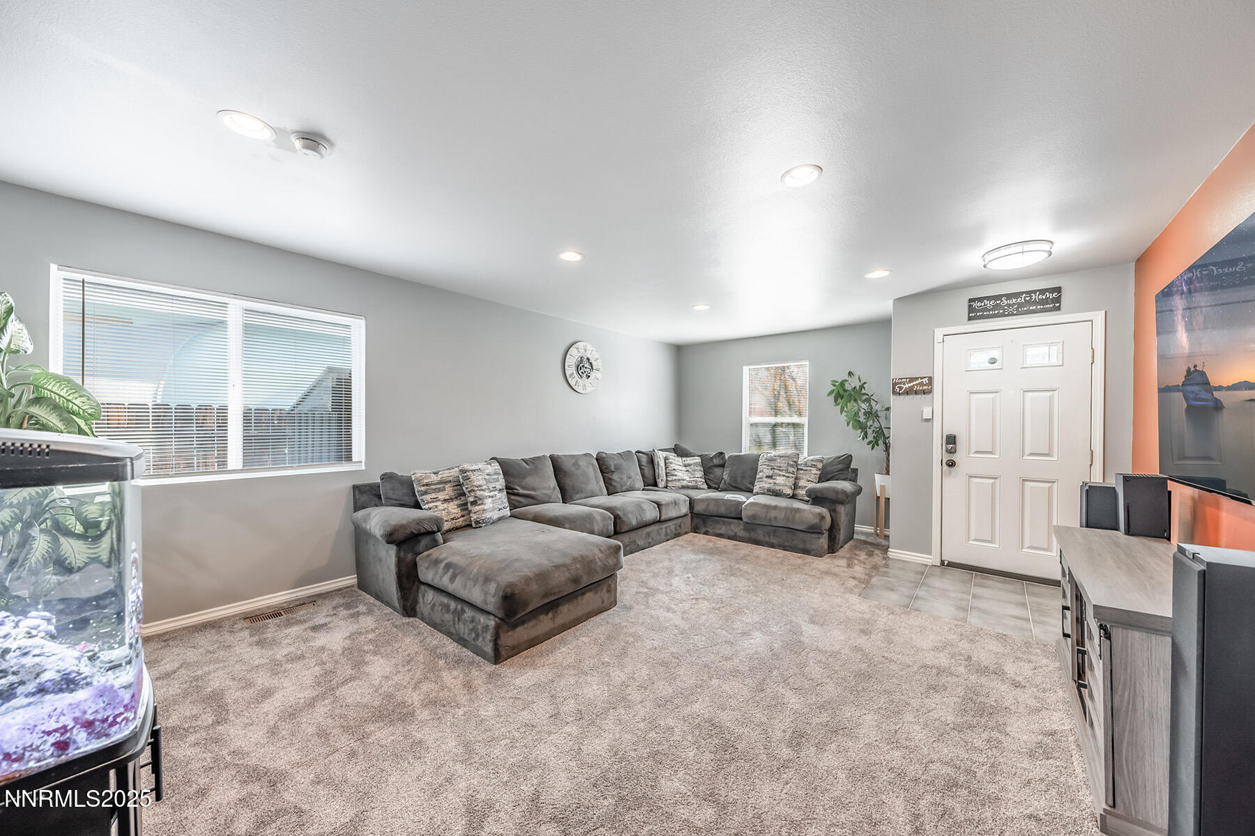 7447 Findhorn Drive Reno, NV 89506 - Photo 7 of 27 a living room with furniture and a large window