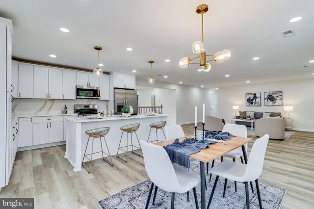 a view of kitchen with cabinets and wooden floor