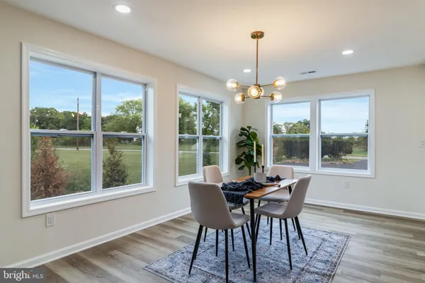 a dining room with furniture window wooden floor