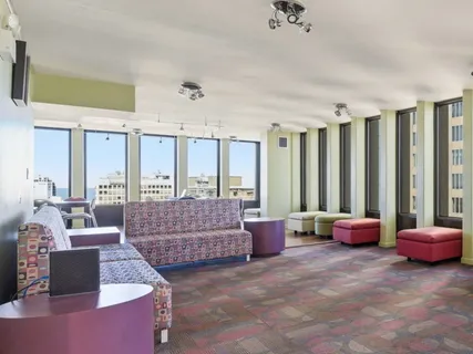 a living room with furniture and a large window