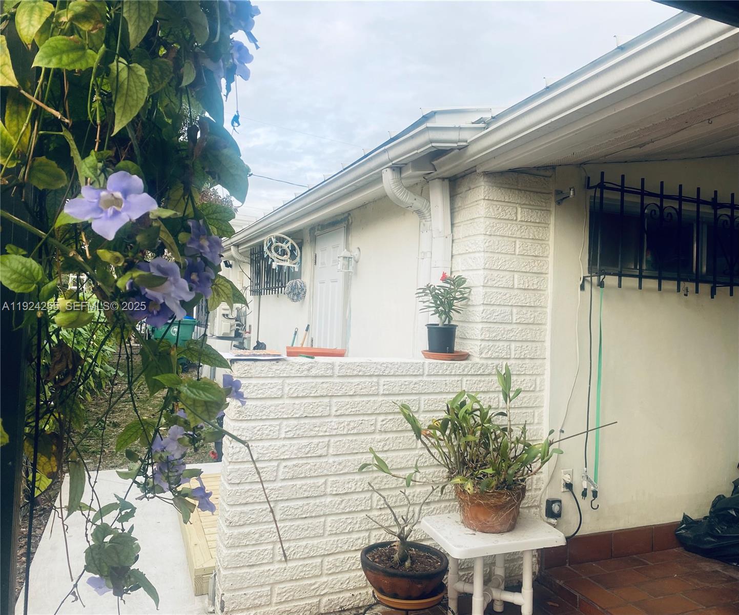 6831 Southwest 2nd Street, Unit FRONT Miami, FL 33144 - Photo 2 of 8 a house with a table and a chair