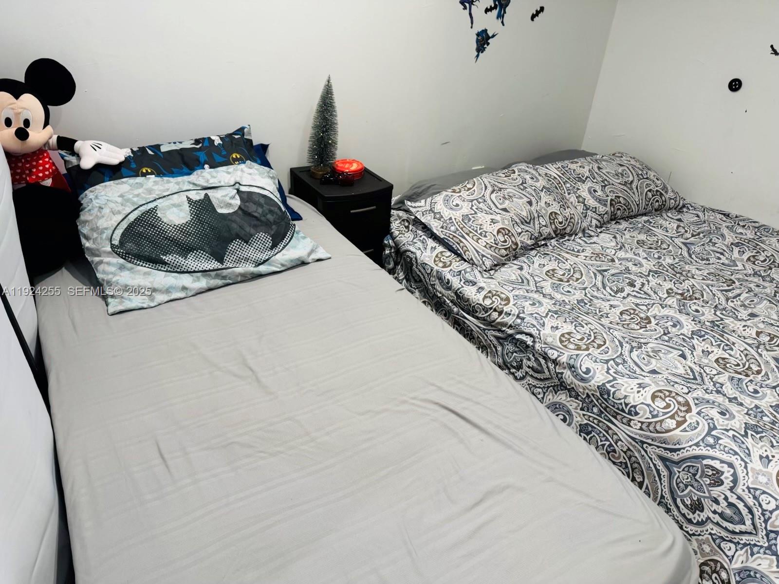 6831 Southwest 2nd Street, Unit FRONT Miami, FL 33144 - Photo 8 of 8 a bedroom with a bed and a stove