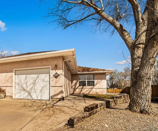 a front view of a house with parking