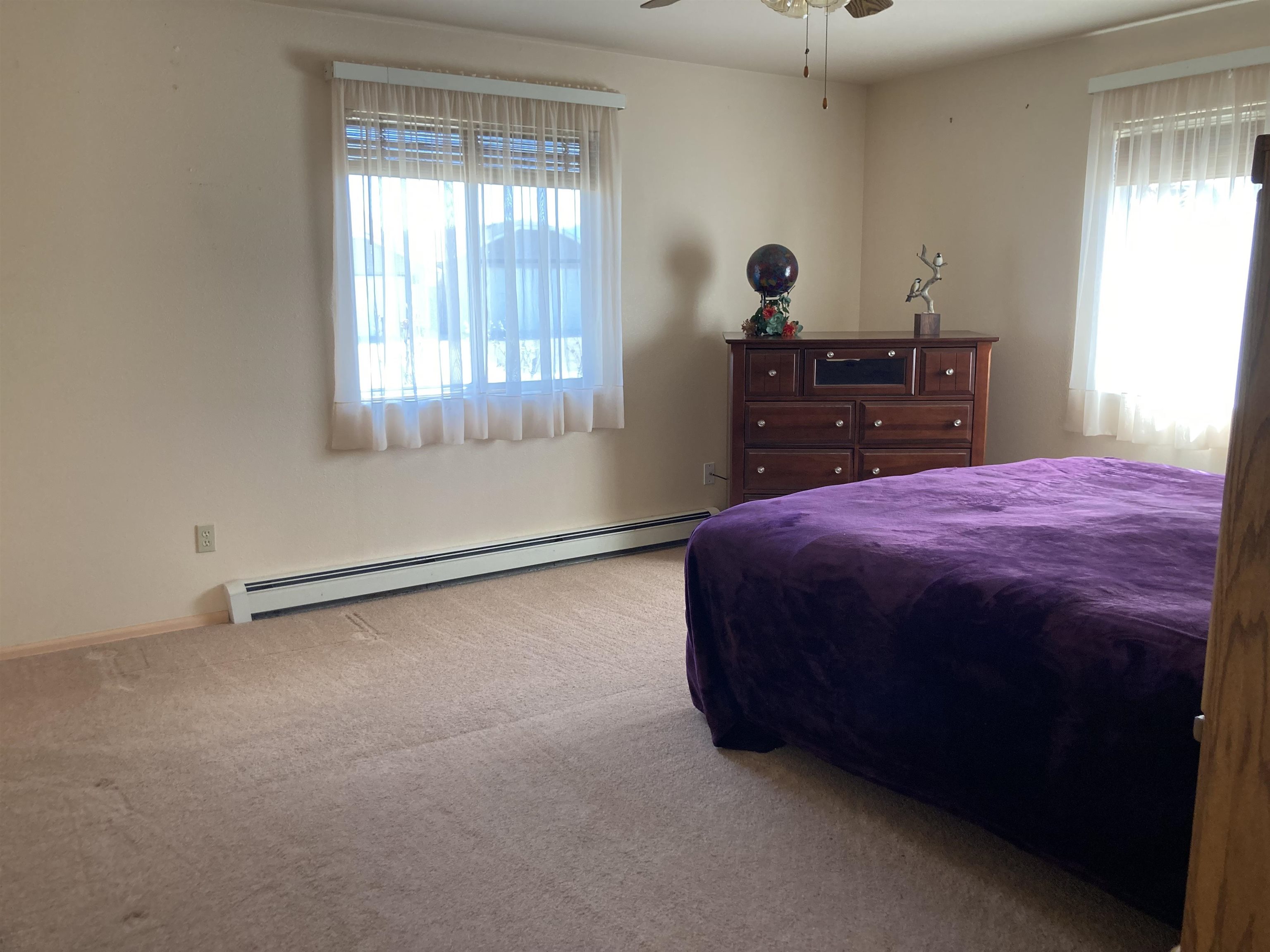 2936 El Torro Road Grand Junction, CO 81503 - Photo 18 of 25 a bed room with a bed and a dresser