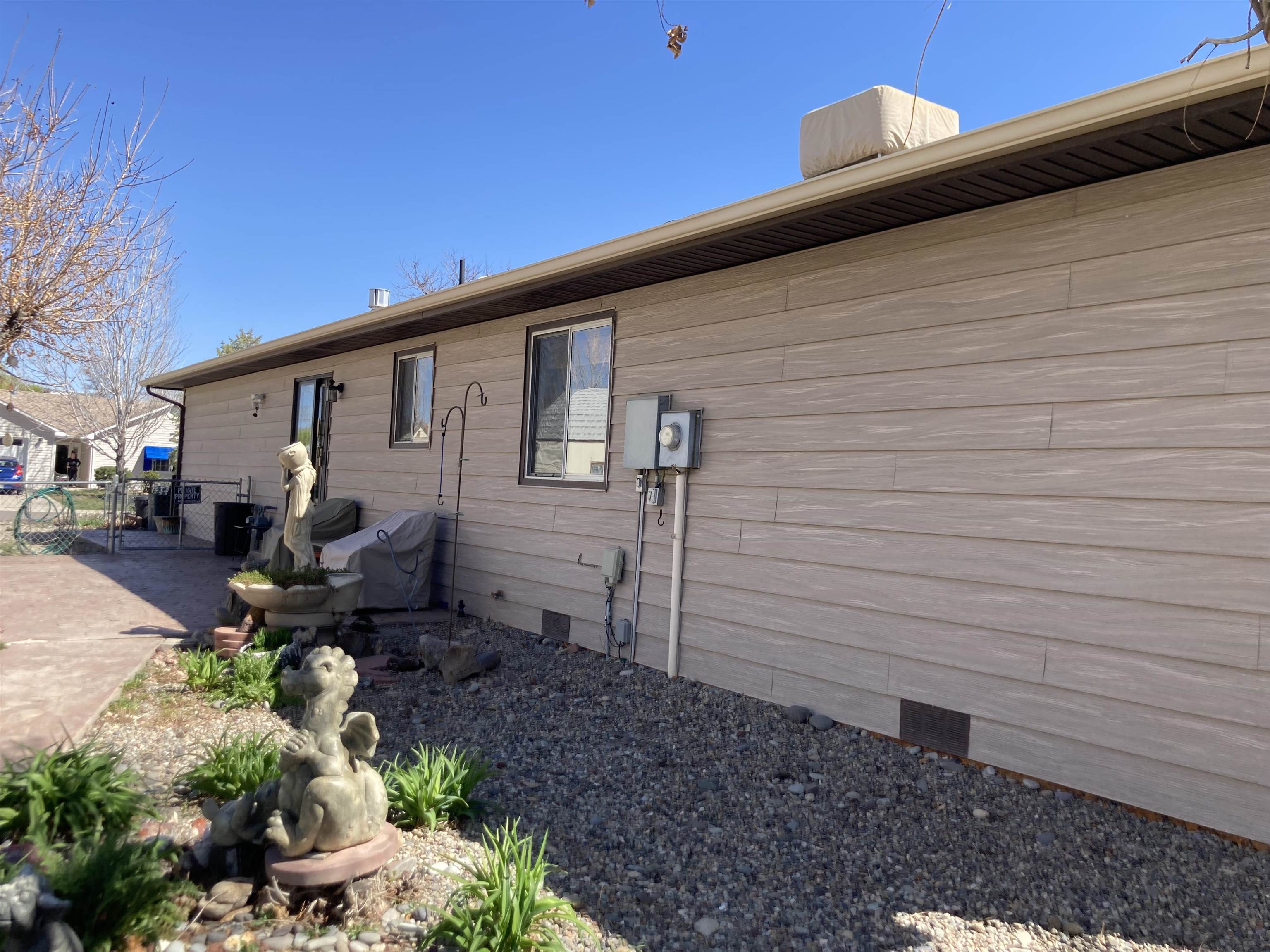 2936 El Torro Road Grand Junction, CO 81503 - Photo 8 of 25 a backyard of a house with outdoor seating