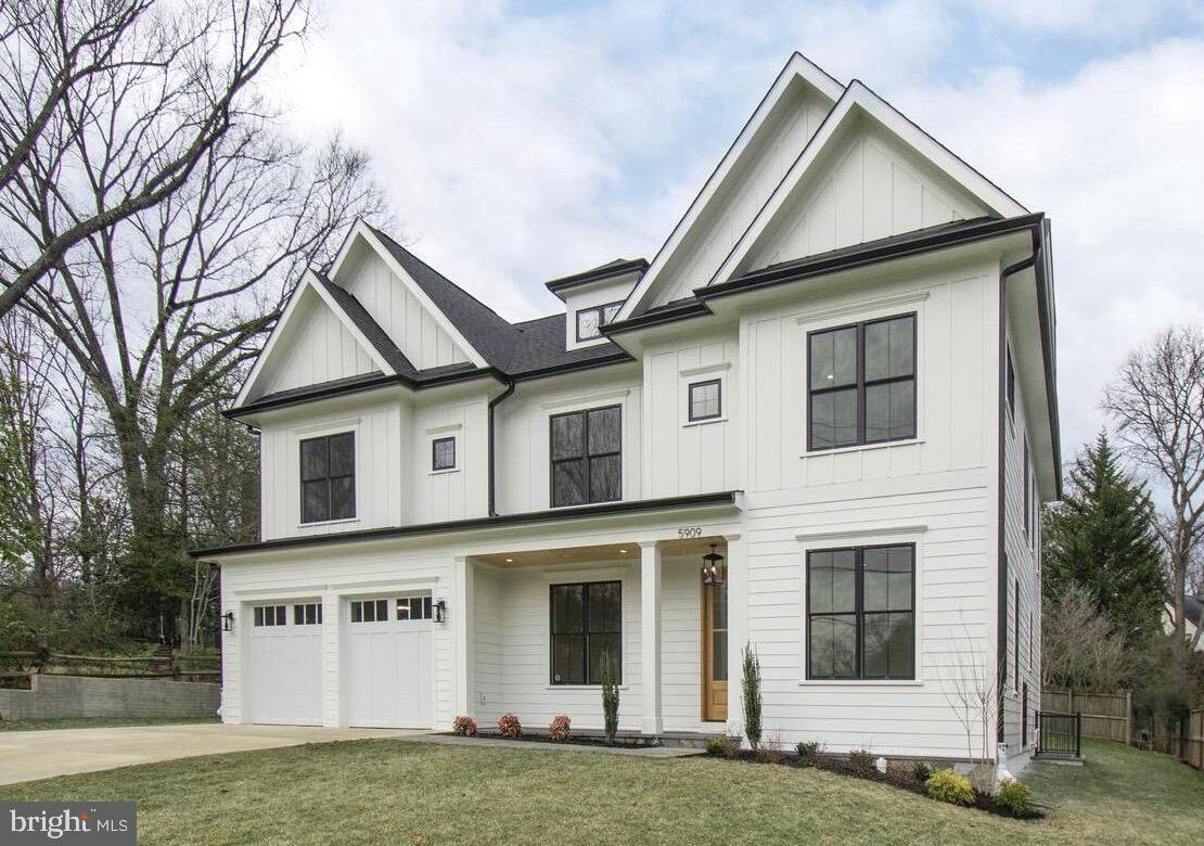 a view of a white house with large windows