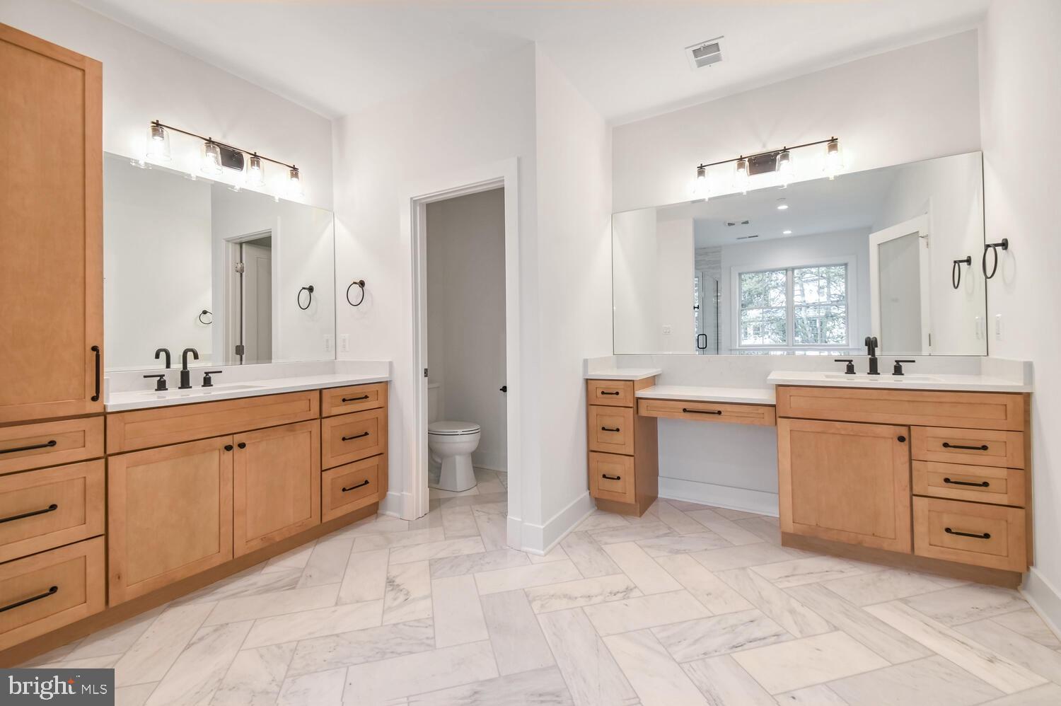 5909 Aberdeen Road Bethesda, MD 20817 - Photo 21 of 44 a spacious bathroom with a granite countertop sink mirror and a