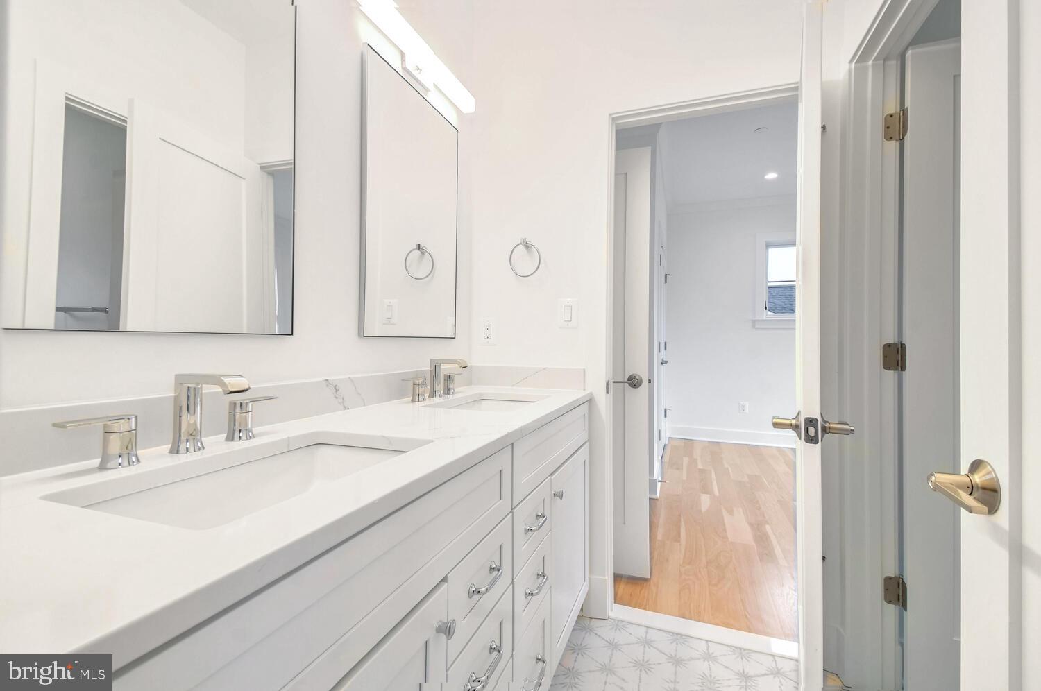 5909 Aberdeen Road Bethesda, MD 20817 - Photo 27 of 44 a bathroom with a sink and a mirror
