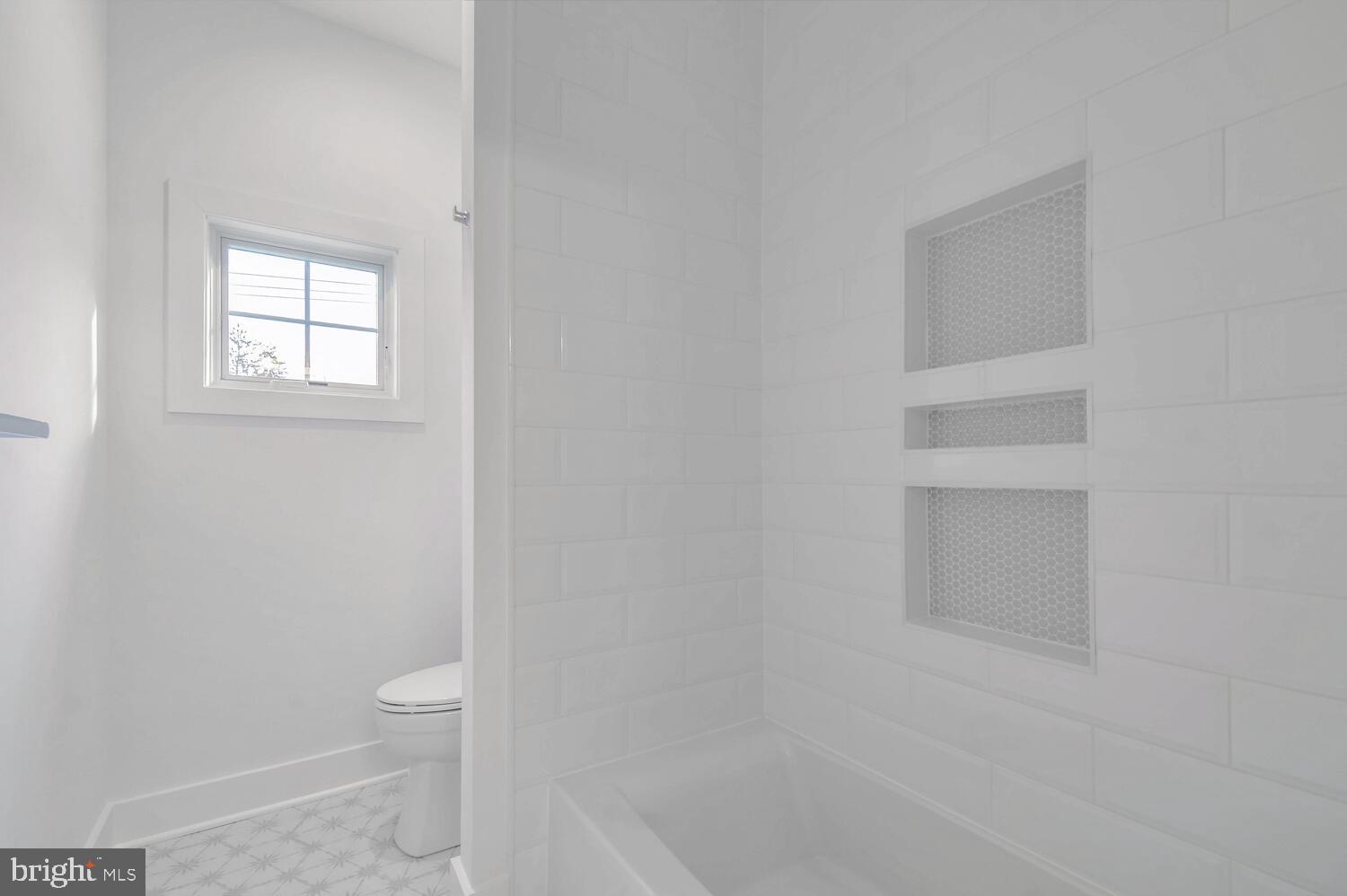 5909 Aberdeen Road Bethesda, MD 20817 - Photo 28 of 44 a bathroom with a toilet and a bathtub