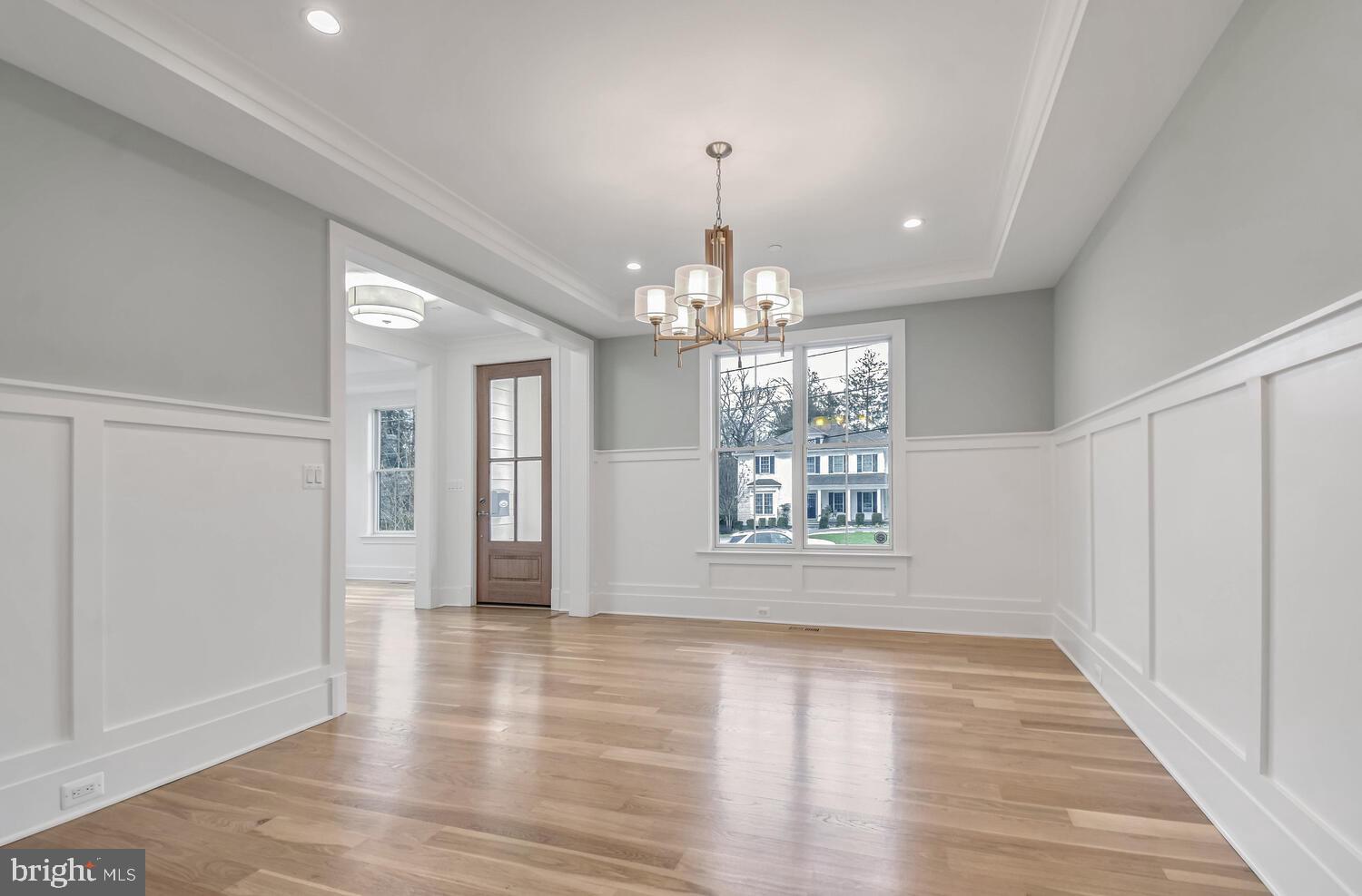5909 Aberdeen Road Bethesda, MD 20817 - Photo 3 of 44 a view of an empty room with wooden floor and a window