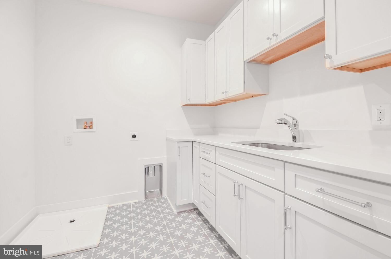 5909 Aberdeen Road Bethesda, MD 20817 - Photo 32 of 44 a bathroom with a sink a toilet and shower