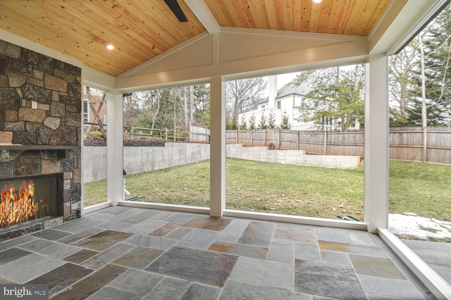 5909 Aberdeen Road Bethesda, MD 20817 - Photo 41 of 44 a view of an empty room with wooden floor and a fireplace