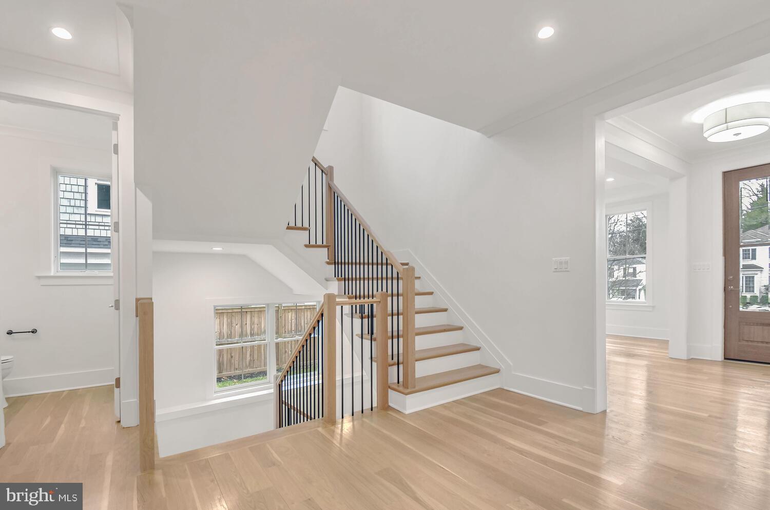 5909 Aberdeen Road Bethesda, MD 20817 - Photo 5 of 44 a view of entryway with wooden floor and stairs