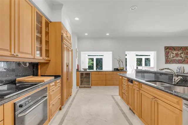 a view of a house with pool and sitting area