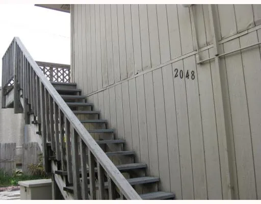 a view of a balcony with staircase