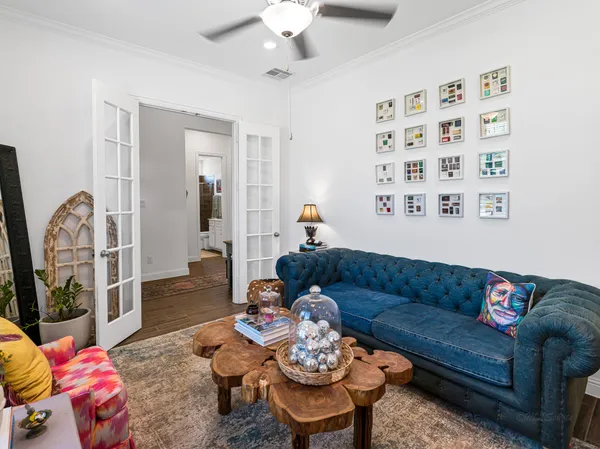 a living room with furniture fireplace and window