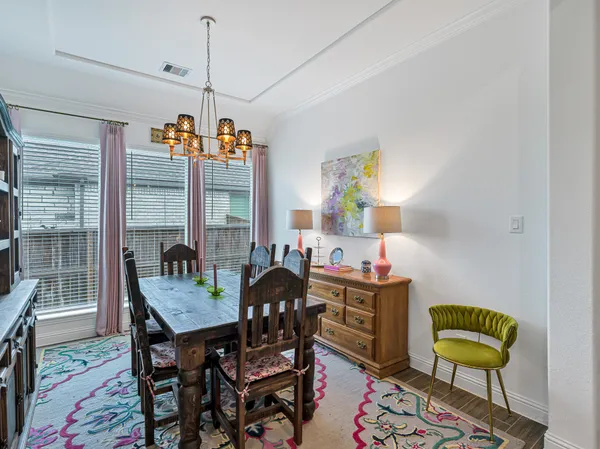 a living room with furniture a ceiling fan and a window