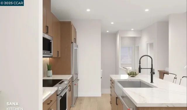 a kitchen with kitchen island a sink stove and refrigerator