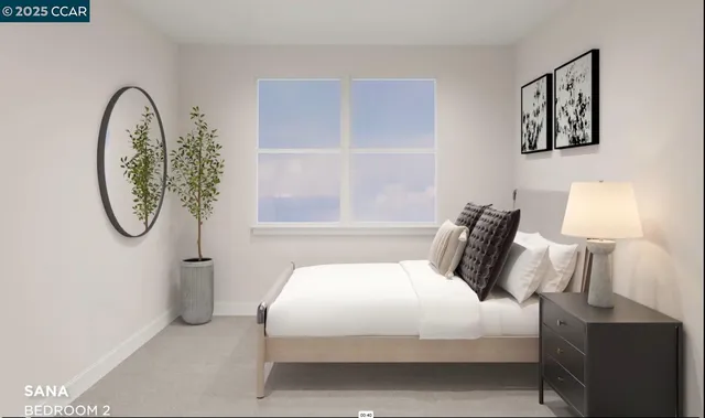 a bedroom with a bed a mirror and a window