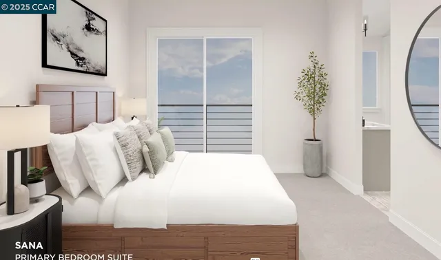 a bedroom with a large bed and a potted plant