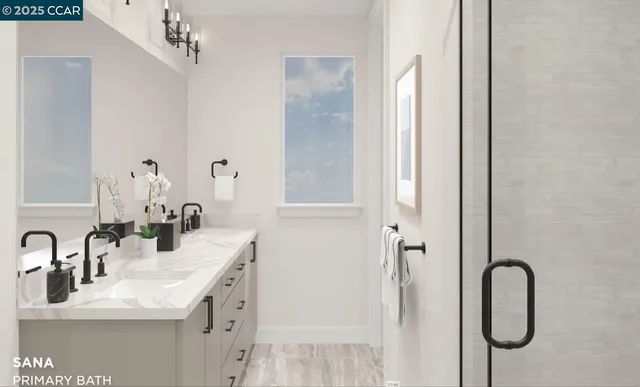 a bathroom with a double vanity sink mirror and shower