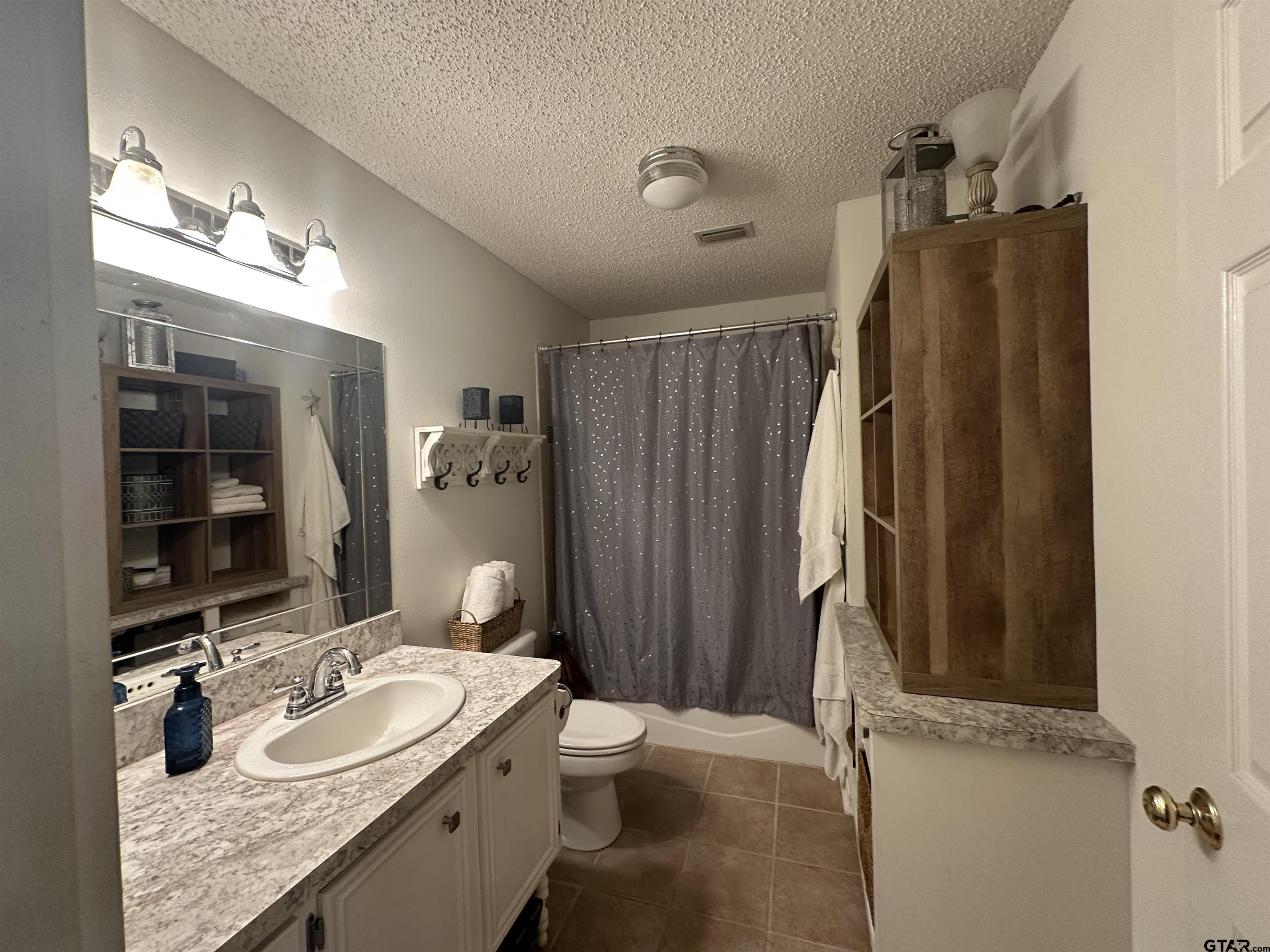 2281 Fm 241s Rusk, TX 75785 - Photo 12 of 31 a bathroom with a granite countertop sink toilet and shower