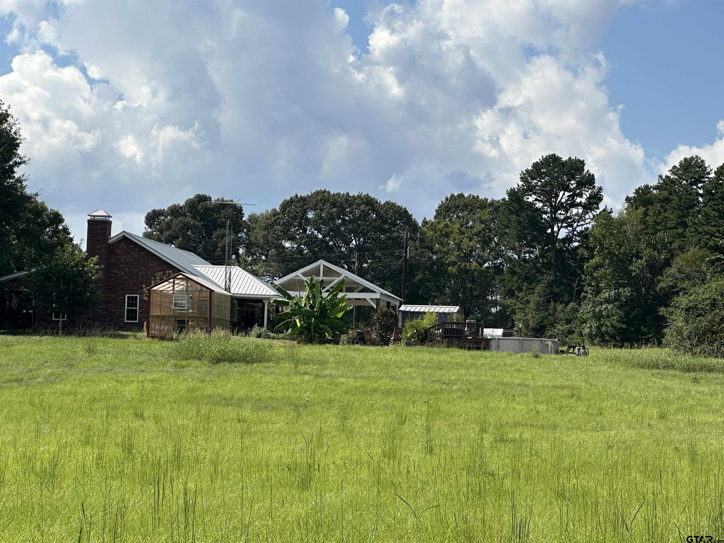 2281 Fm 241s Rusk, TX 75785 - Photo 17 of 31 a view of a house with a big yard and large trees