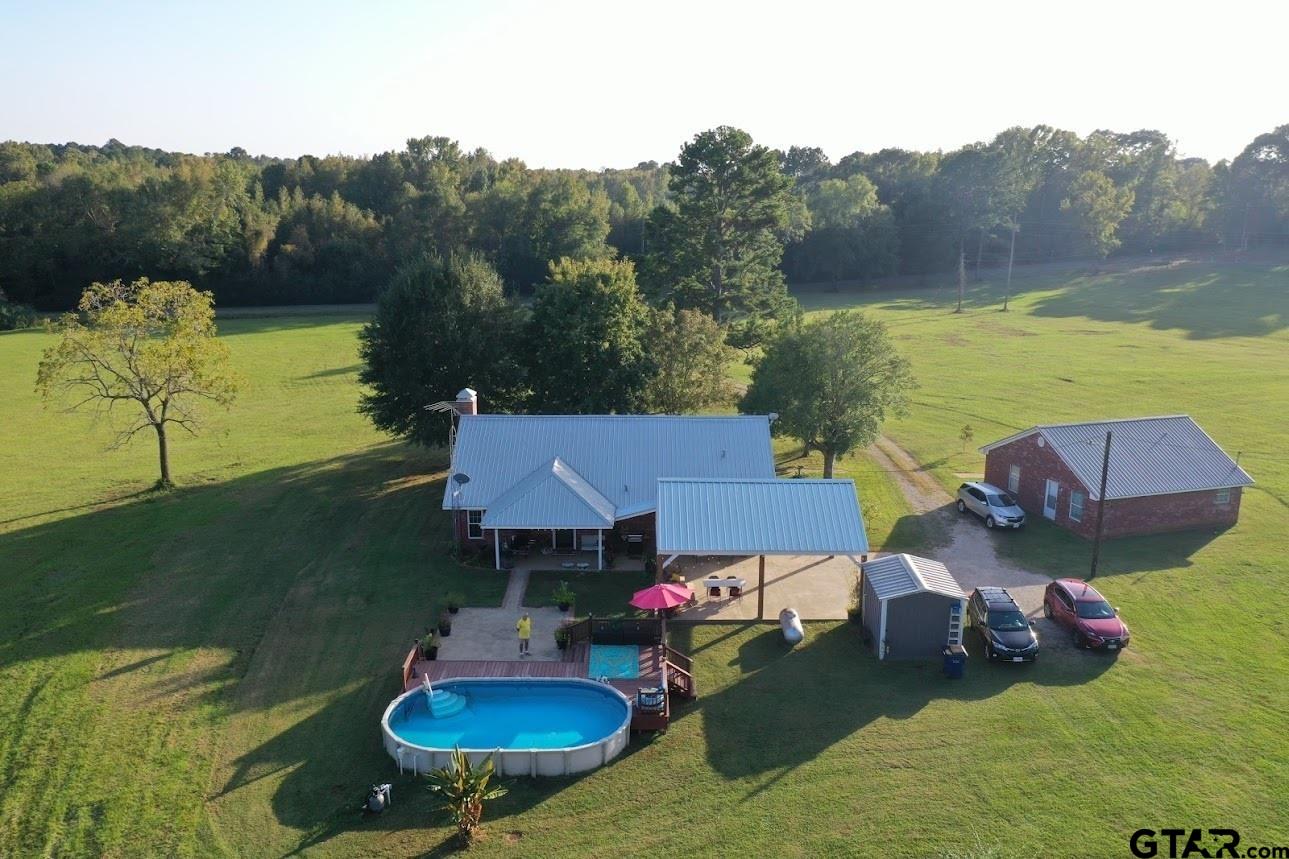 2281 Fm 241s Rusk, TX 75785 - Photo 2 of 31 a backyard of a house with yard table and chairs