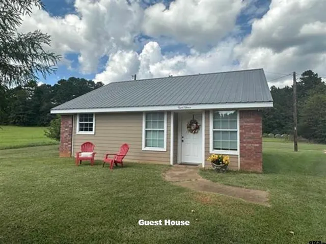 a kitchen with a white cabinets and white appliances