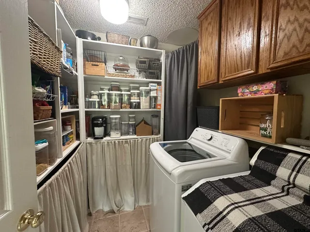 a spacious bedroom with a bed and a couch