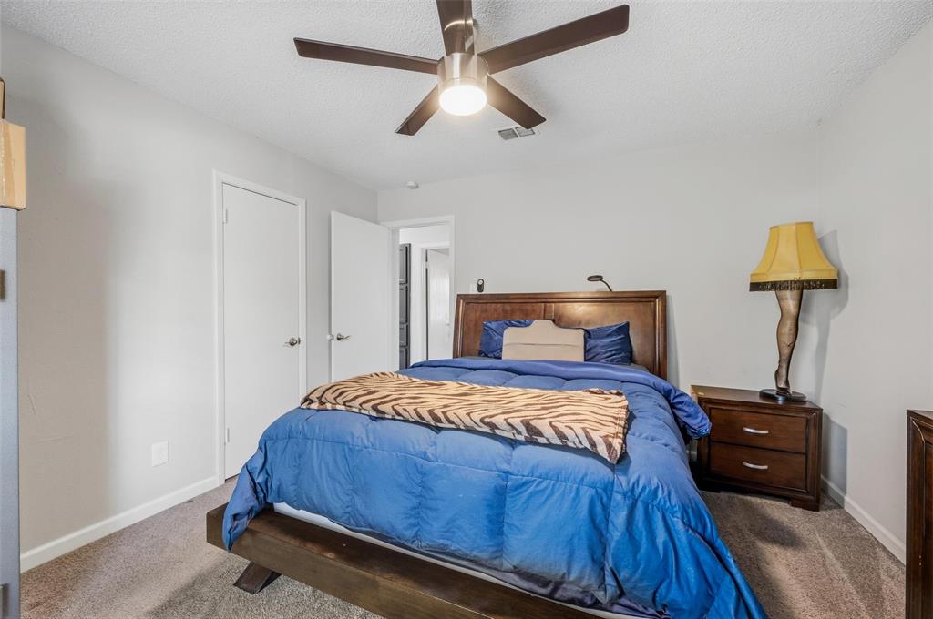 608 Ridgewood Circle Hurst, TX 76054 - Photo 21 of 38 Recessed lighting, ceiling fan, and light gray wall paint