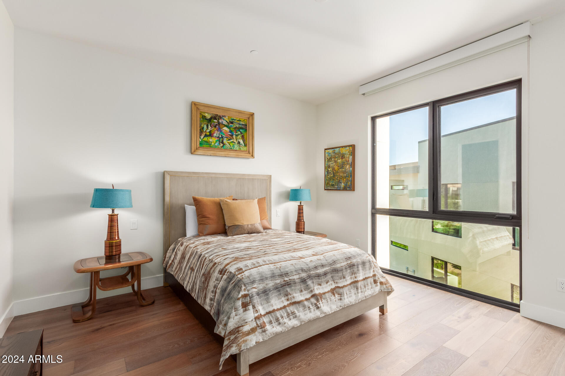 6311 East Phoenician Boulevard, Unit 18 Scottsdale, AZ 85251 - Photo 28 of 45 a bedroom with a bed and a night stand