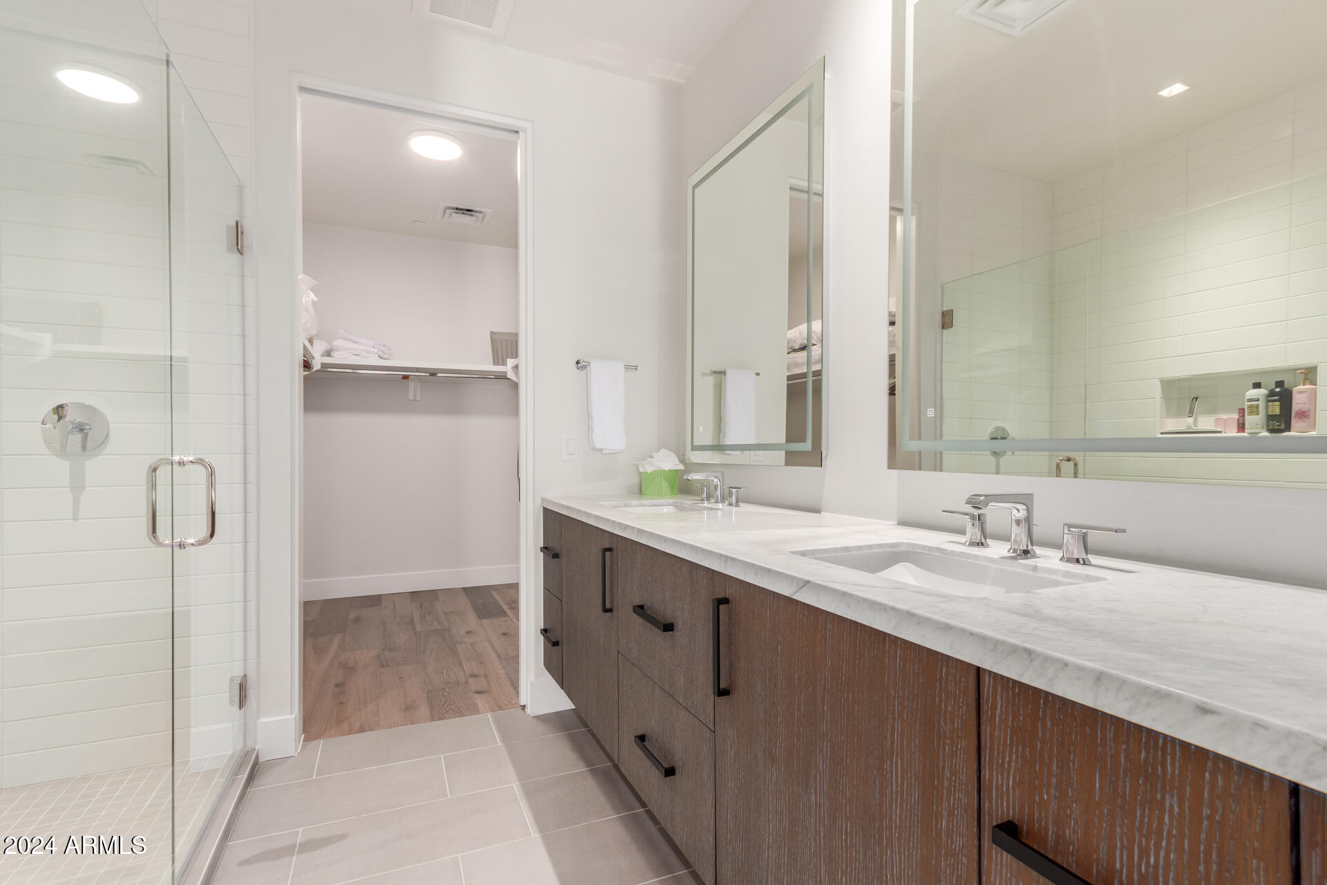 6311 East Phoenician Boulevard, Unit 18 Scottsdale, AZ 85251 - Photo 32 of 45 a bathroom with a double vanity sink mirror and double