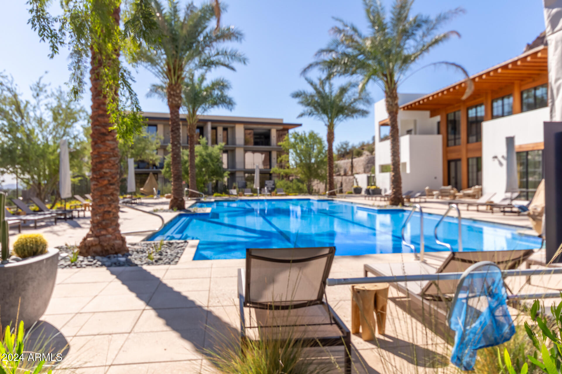 6311 East Phoenician Boulevard, Unit 18 Scottsdale, AZ 85251 - Photo 42 of 45 a view of a swimming pool with a patio