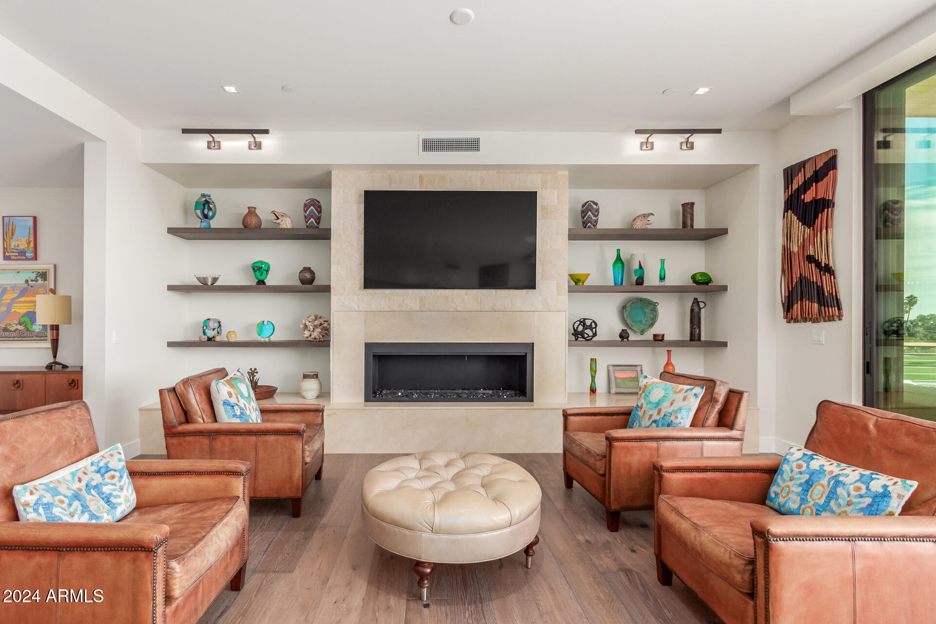 6311 East Phoenician Boulevard, Unit 18 Scottsdale, AZ 85251 - Photo 7 of 45 a living room with furniture and a flat screen tv