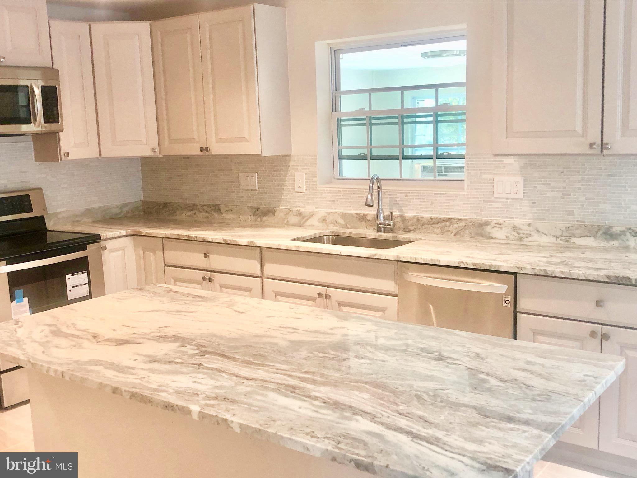 2112 Drury Road Silver Spring, MD 20906 - Photo 10 of 29 KITCHEN WITH WINDO VIEW TO SUNROOM