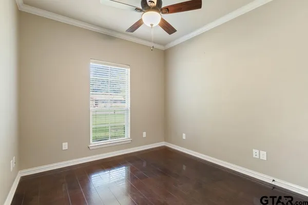 a bathroom with a granite countertop sink a large mirror and a shower