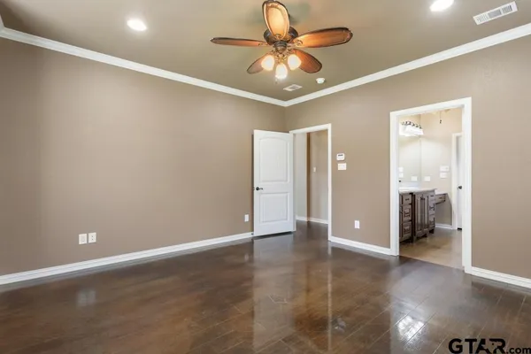 a living room with hard wood floors and a fireplace