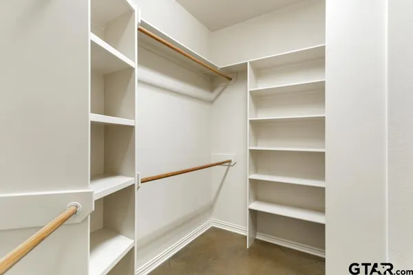 a kitchen with granite countertop a sink stainless steel appliances and counter space