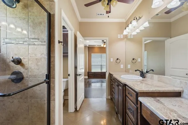 a kitchen with kitchen island granite countertop a stove and a sink