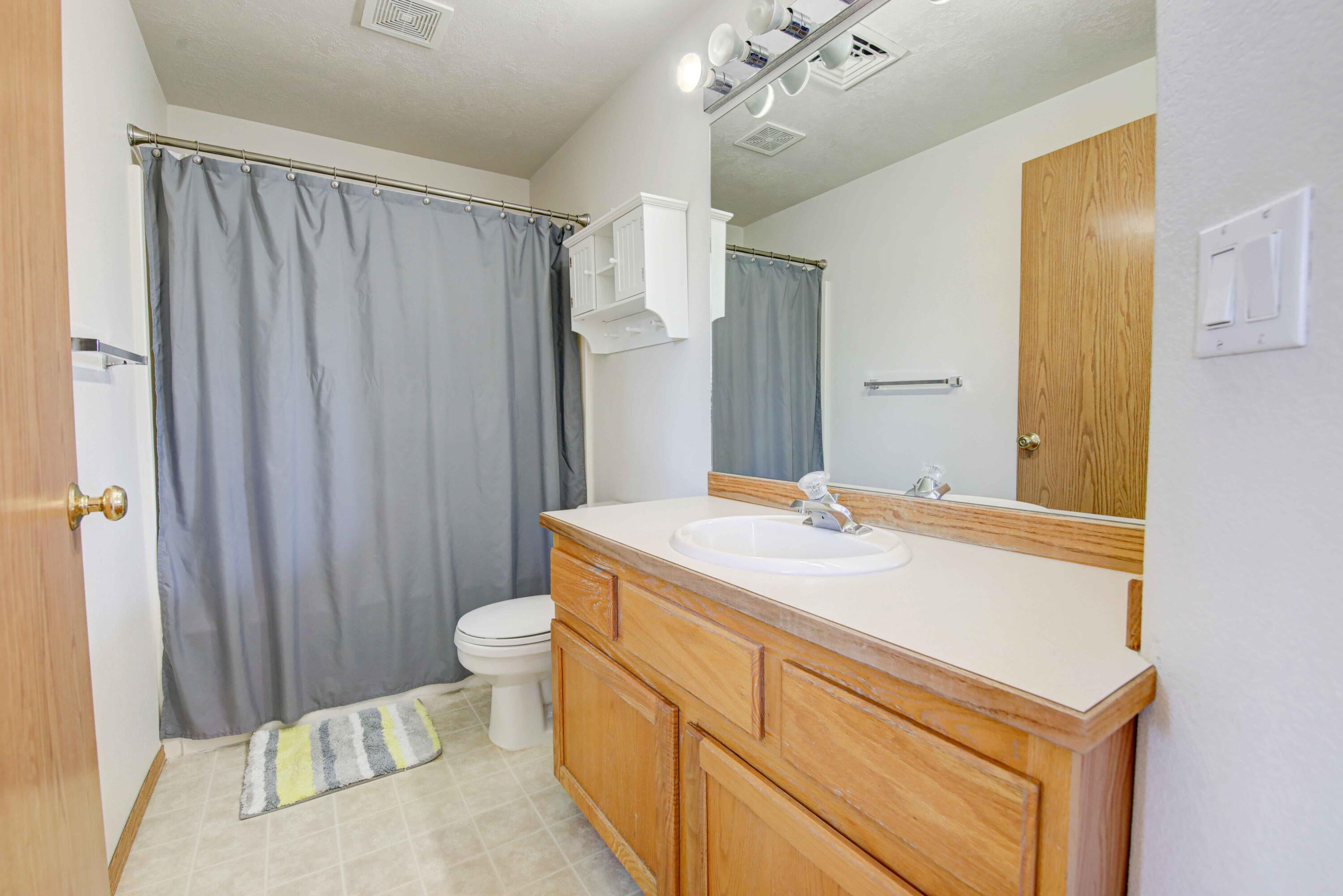 1446 Southwest 16th Street Redmond, OR 97756 - Photo 13 of 17 Full bathroom upstairs is conveniently located next to the second bedroom.