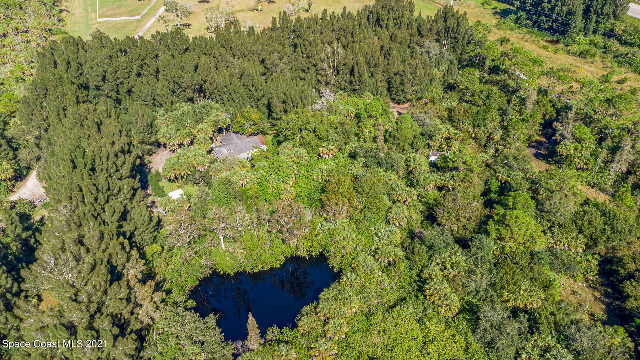 1717 Jones Road Melbourne, FL 32934 - Photo 7 of 20 a view of a house with a yard